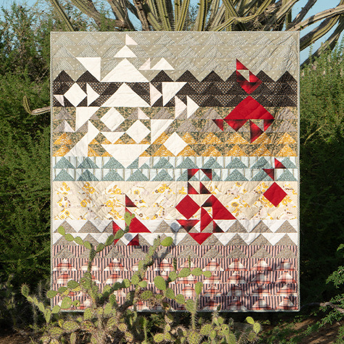 花のすべてをキルトで表現した《アー・ペー・セー キルト》。